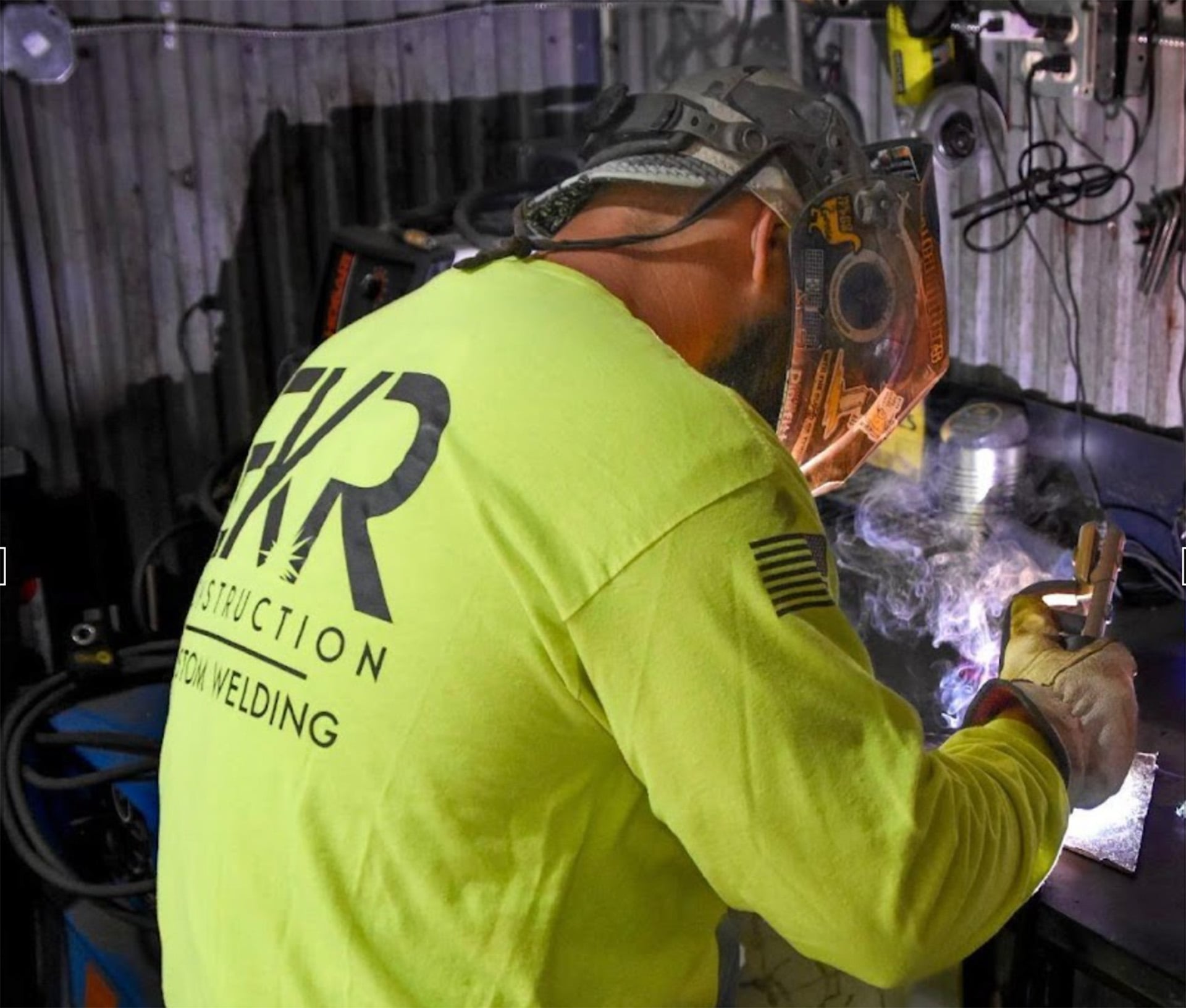 Welding sparks illuminating industrial fabrication work